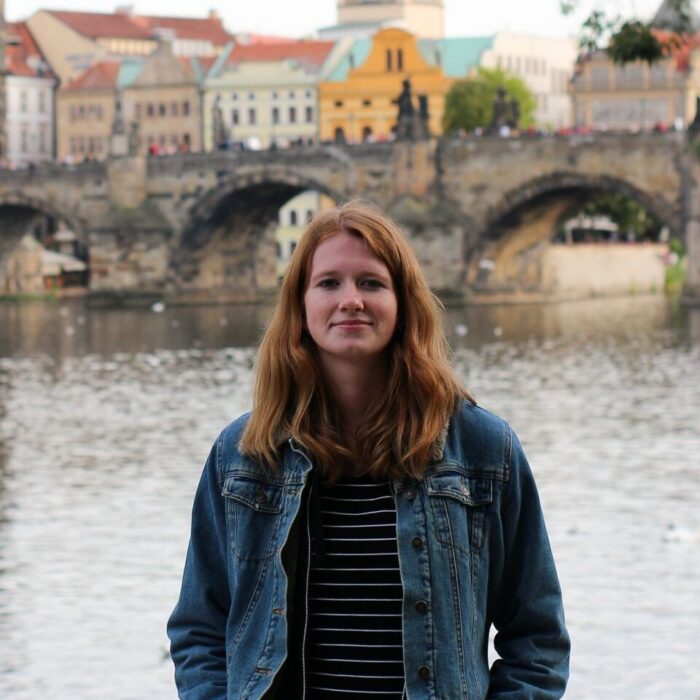 Michaela with the background of the Charles Bridge in Prague, Czechia